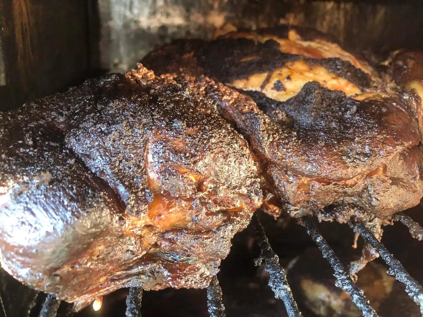 Slow-smoked meats in the wood-fired smoker